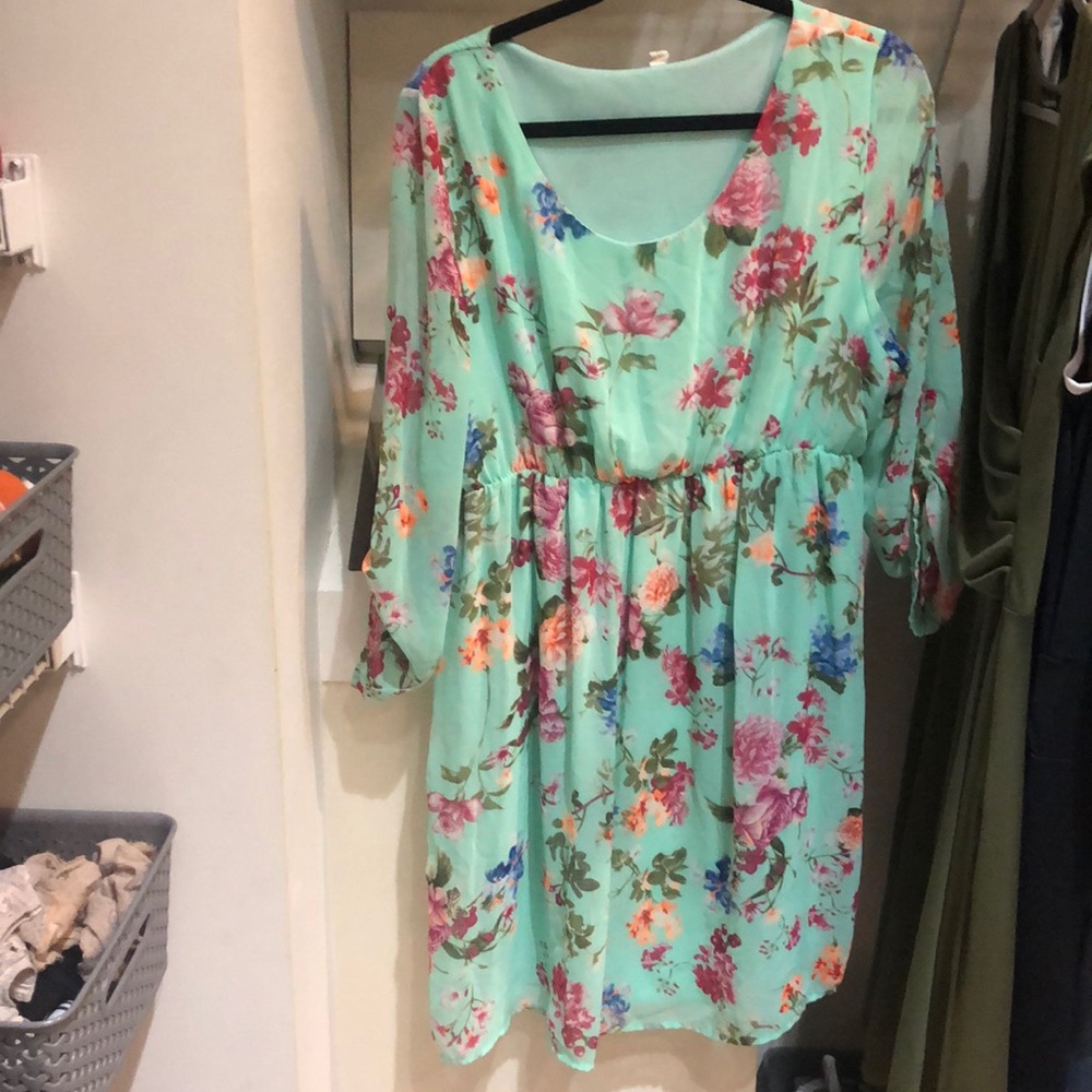 Maternity dress. Floral and around knee length.